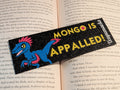 Black bookmark with "MONGO IS APPALLED!" in yellow and an image of Mongo in blue with Pink Feathers next to the text